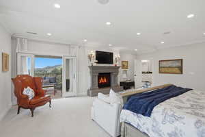 Primary bedroom with fireplace and private balcony