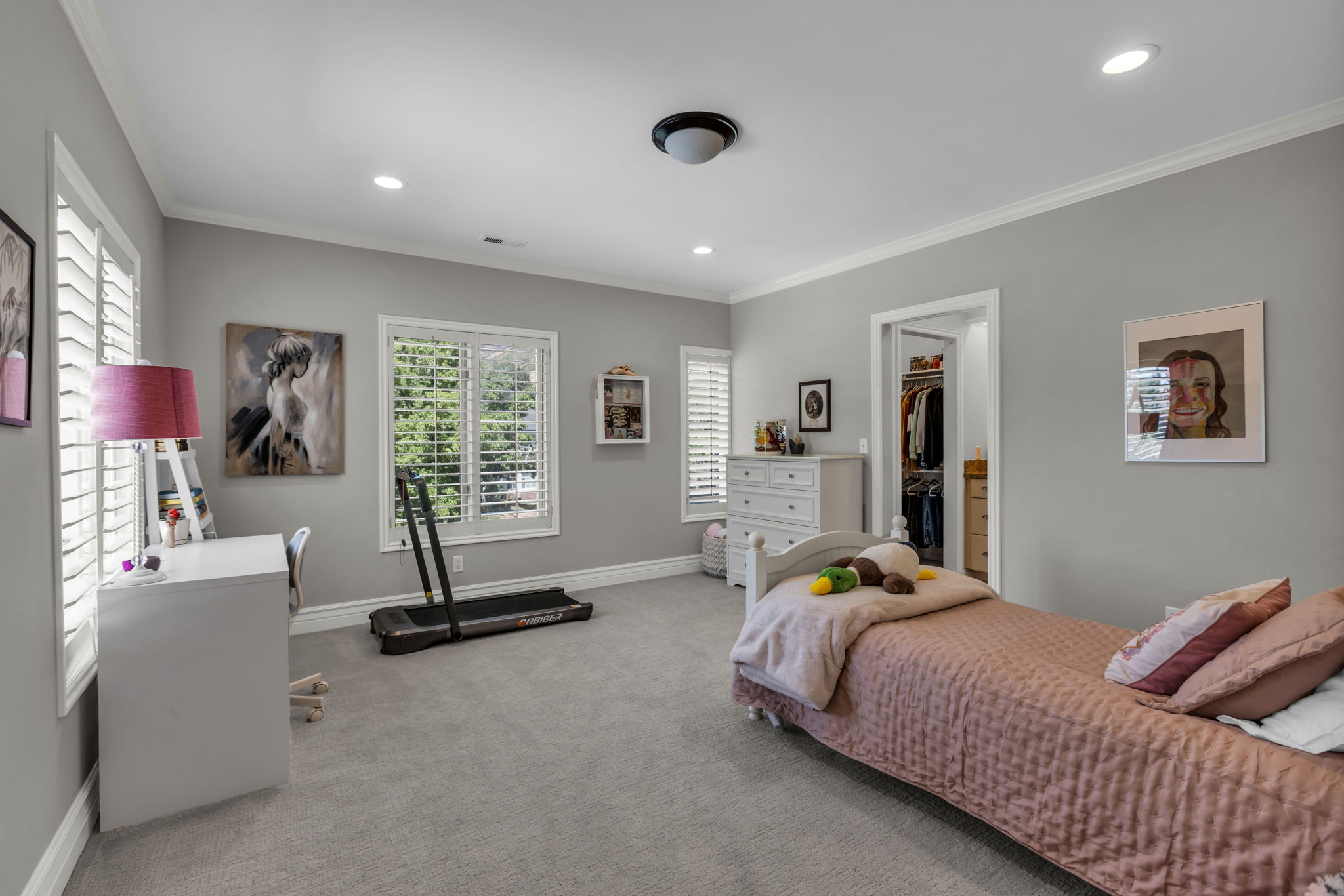 Spacious bedroom with a walk-in closet and private ensuite bathroom