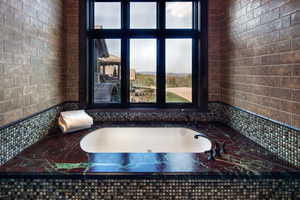 Full bathroom featuring a garden tub