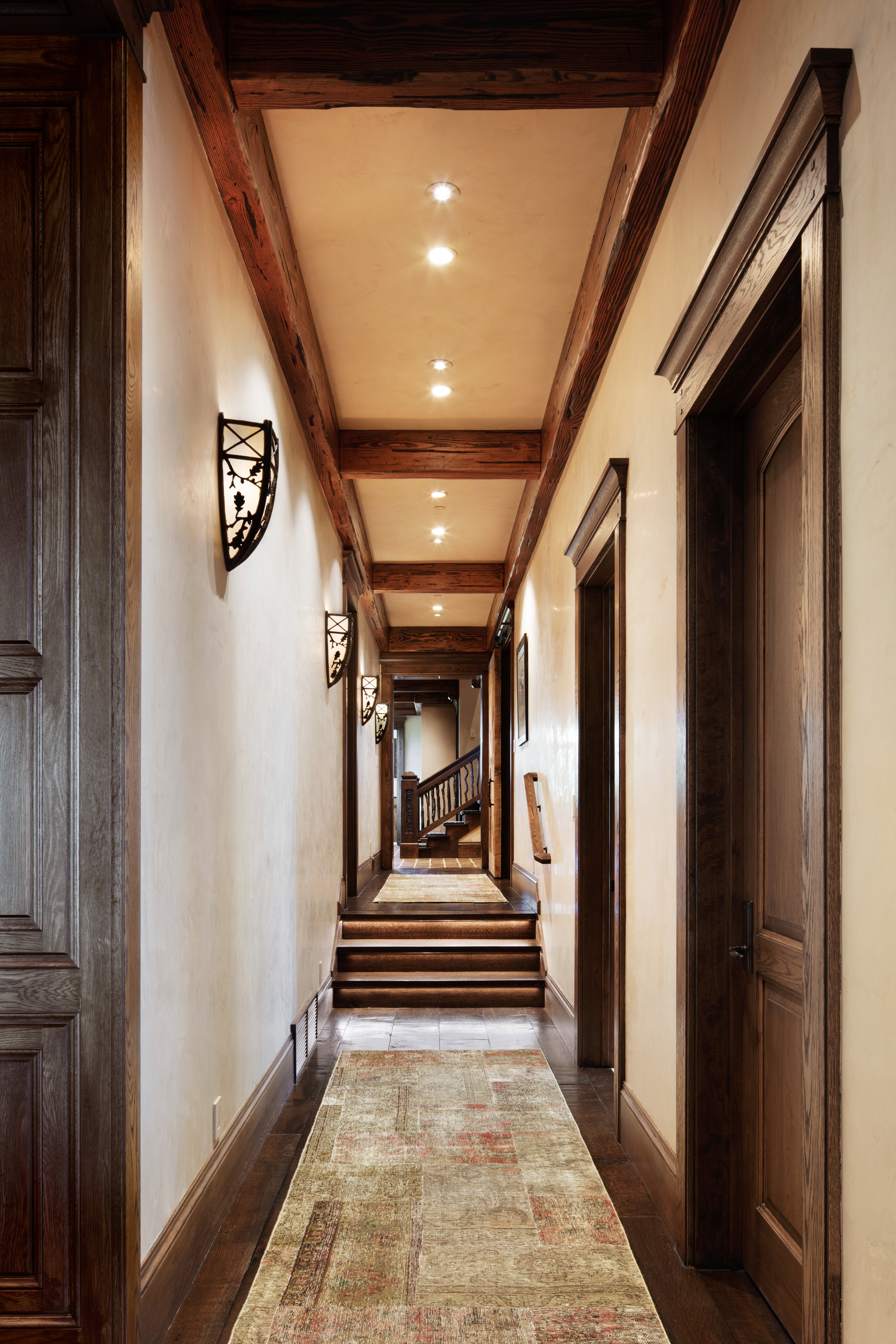 Hall with beamed ceiling and recessed lighting