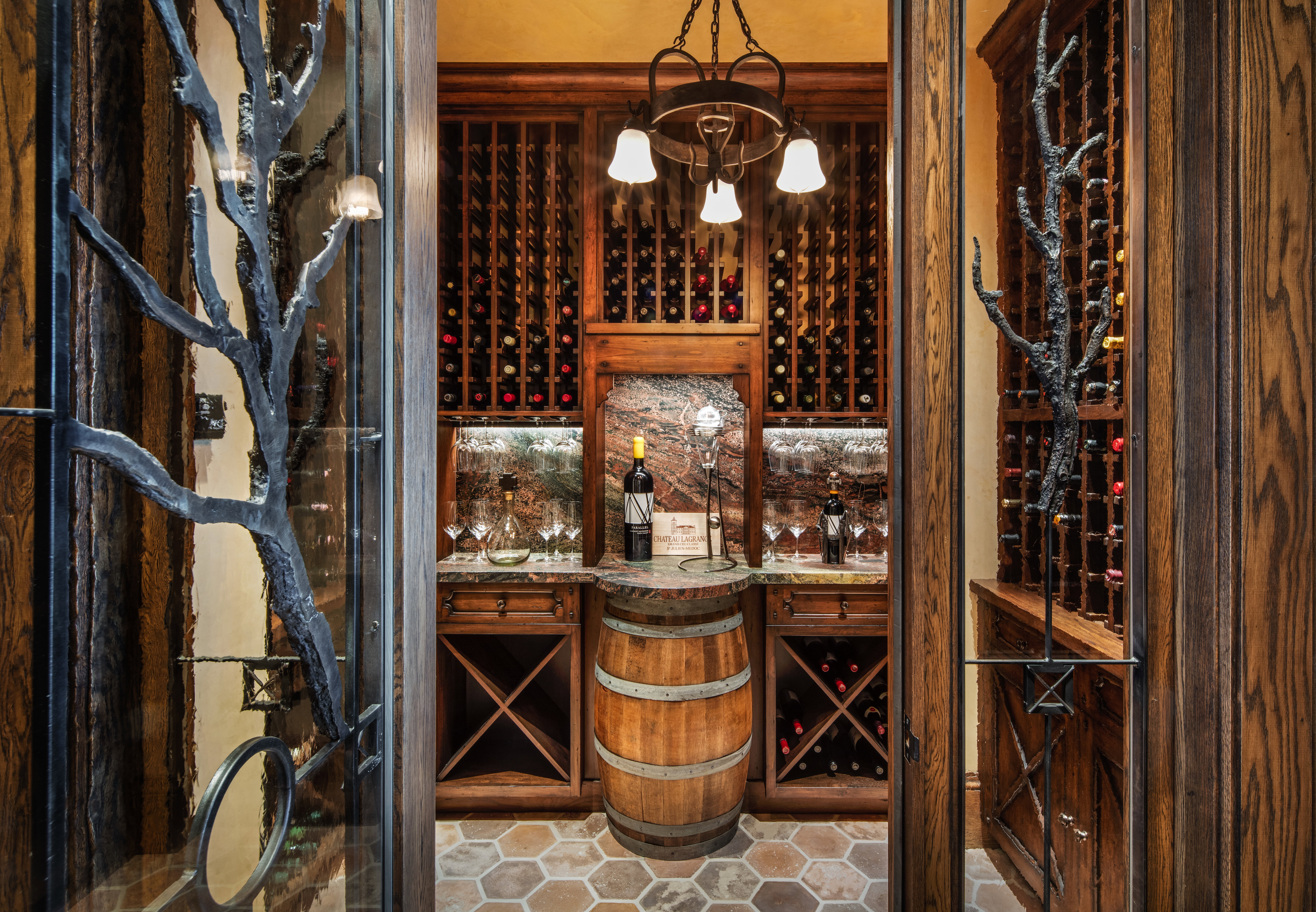 Wine room featuring suspended lighting
