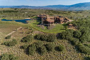 Bird's eye view of a water and mountain view and a forest
