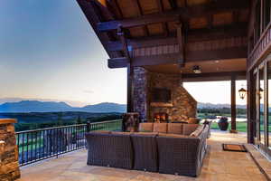 View of patio / terrace with an outdoor living space with a fireplace