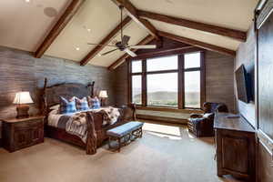 Bedroom with light carpet, wallpapered walls, ceiling fan, and beam ceiling