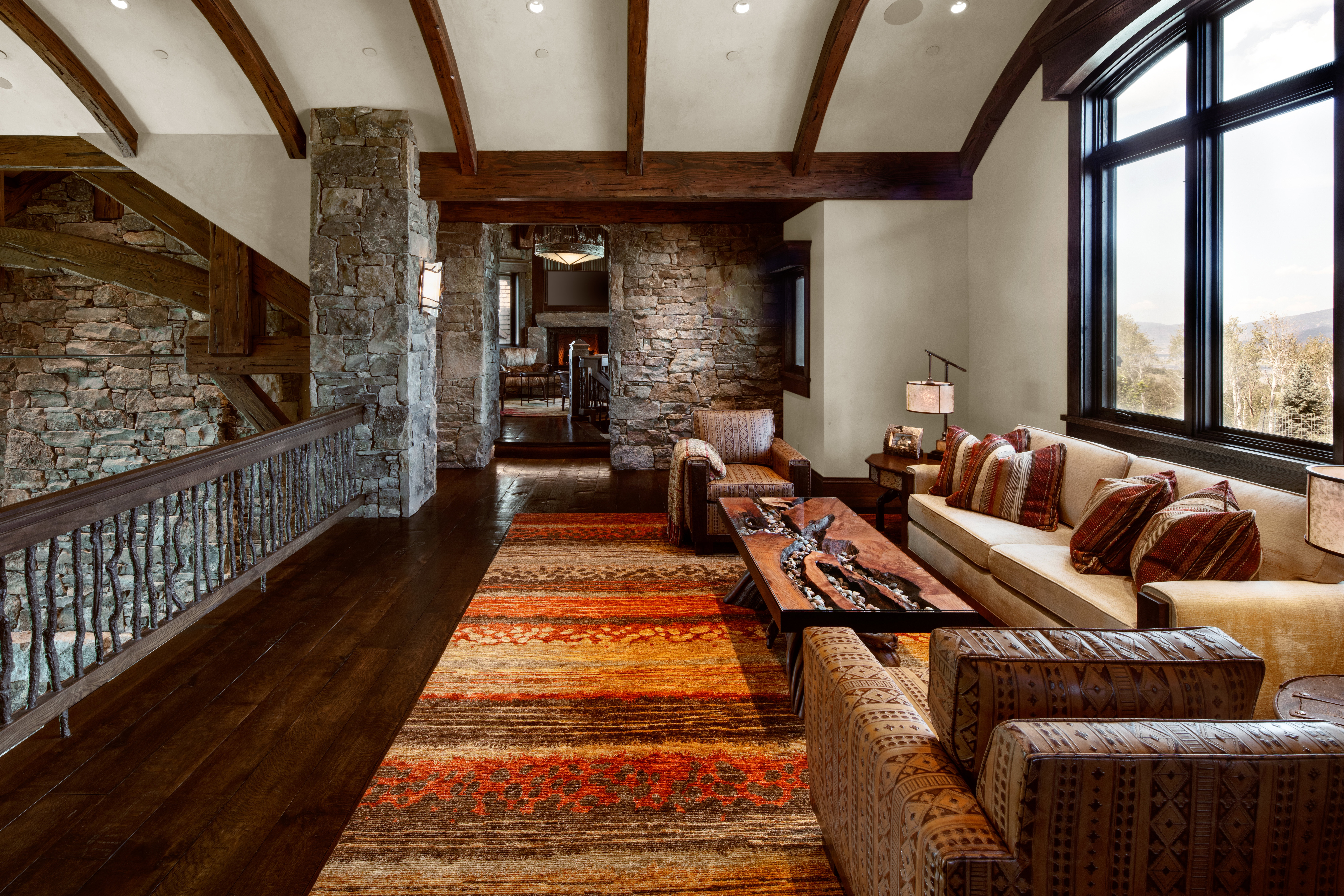 Living room featuring dark wood-type flooring and beamed ceiling