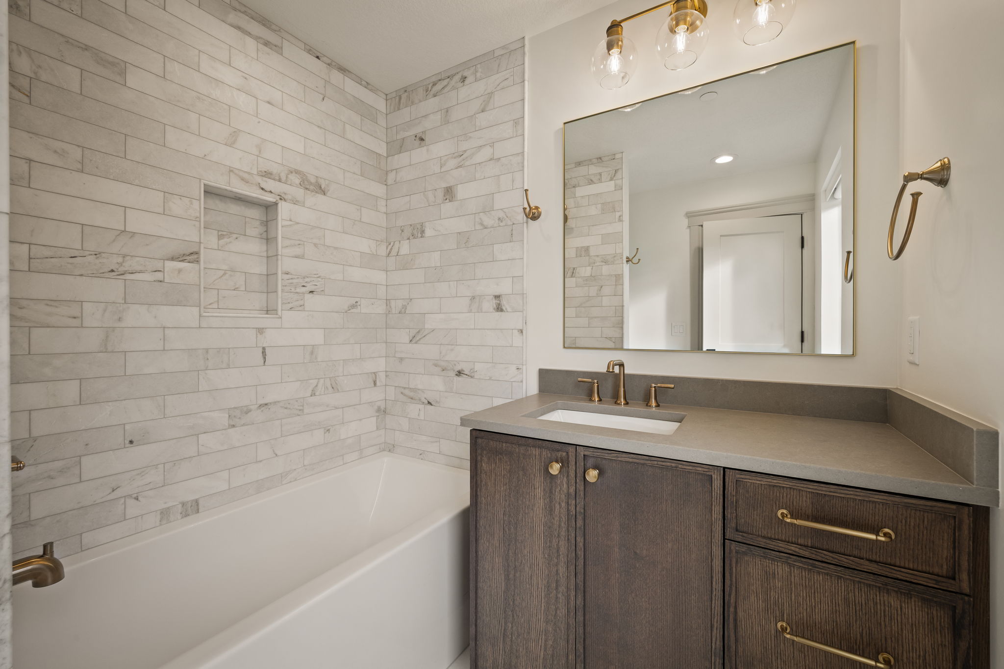 Full bath with vanity and shower / bath combination