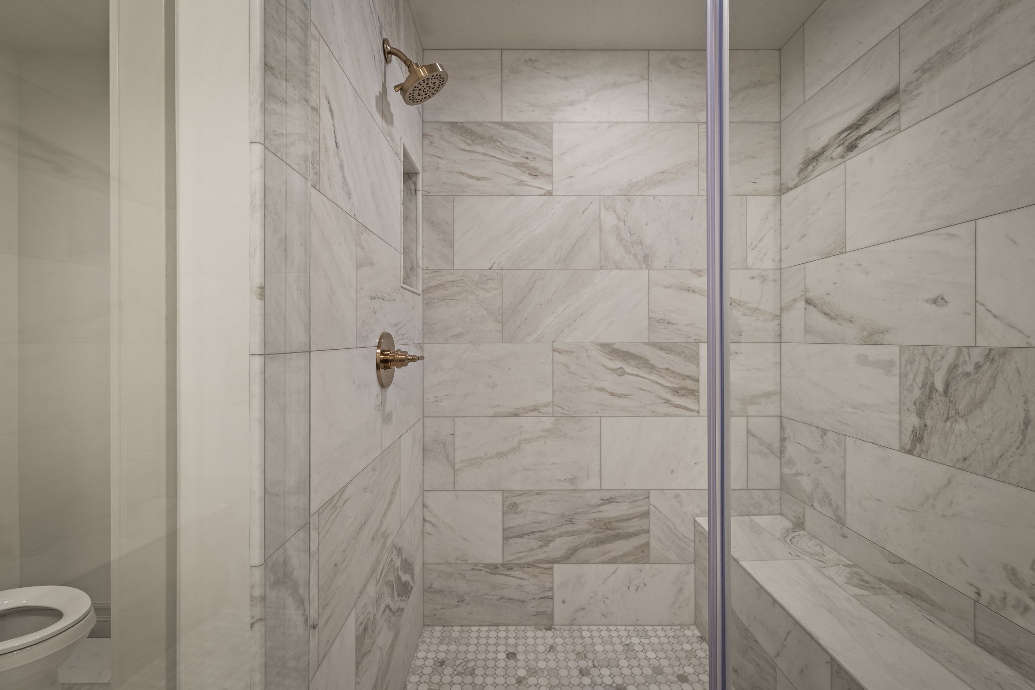 Full bathroom featuring a shower stall
