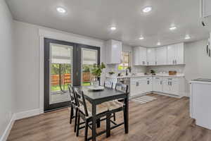 Dining room featuring recessed lighting and light wood-style floors