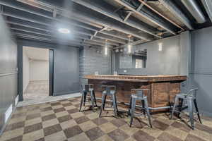 Community bar area featuring brick wall