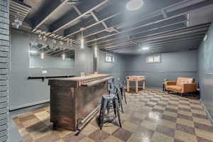 Indoor dry bar with wainscoting