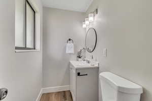 Bathroom with vanity and light wood finished floors