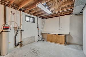 Basement with a water softener system and drainage system