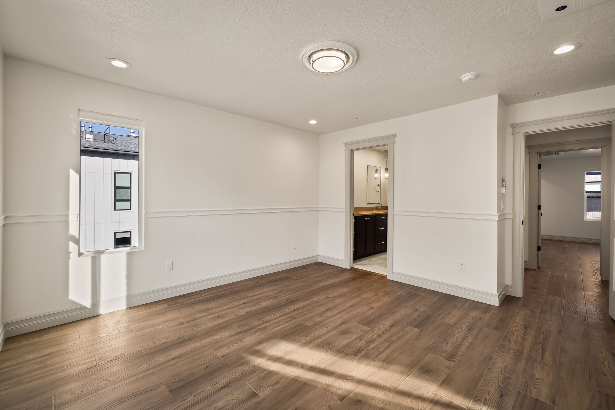 Spare room with dark wood-type flooring, recessed lighting, and a textured ceiling