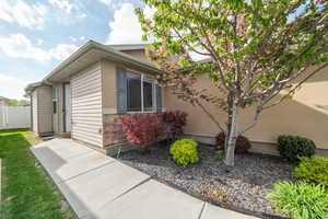 View of side of property featuring stone siding