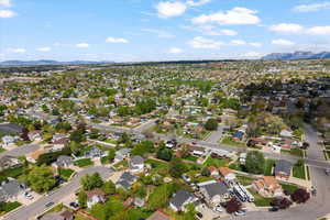Aerial perspective of suburban area featuring a mountain backdrop