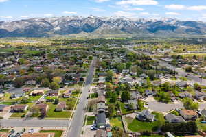 Aerial perspective of suburban area with mountains and property parcel outlined