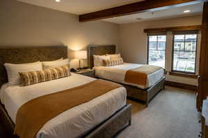 Bedroom with recessed lighting and beamed ceiling