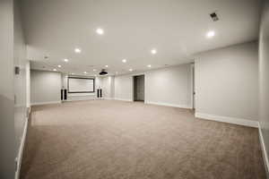 Unfurnished room with recessed lighting and light colored carpet