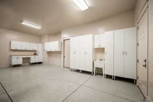 Garage featuring baseboards