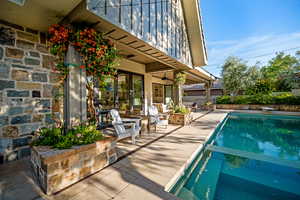 Relaxing pool / spa featuring a patio area
