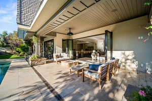 View of patio / terrace featuring an outdoor living space with a fire pit and an outdoor pool