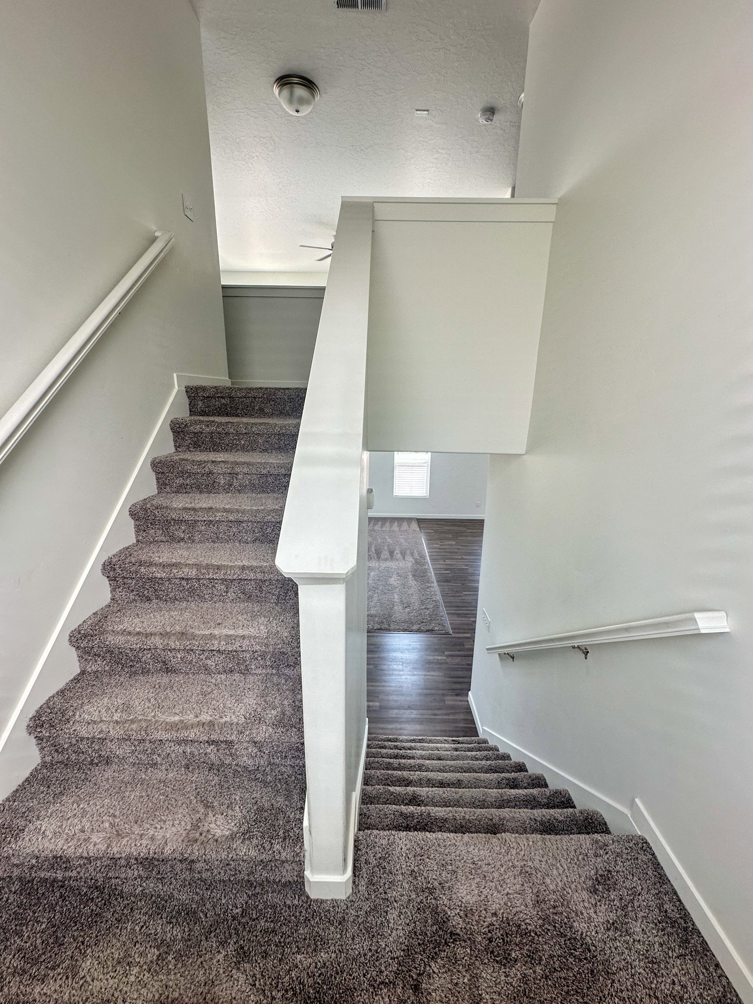 Stairway featuring baseboards