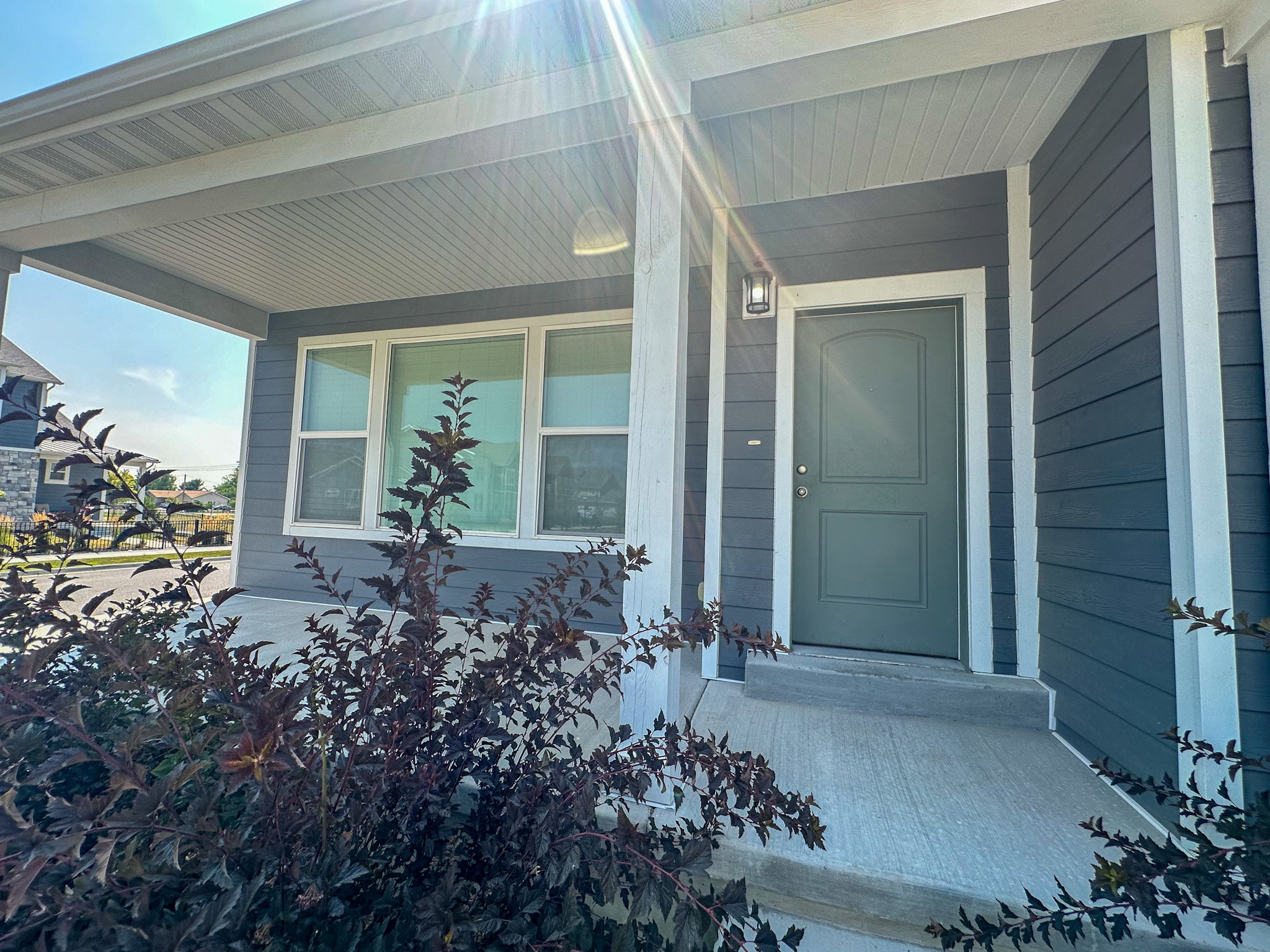 Property entrance featuring covered porch