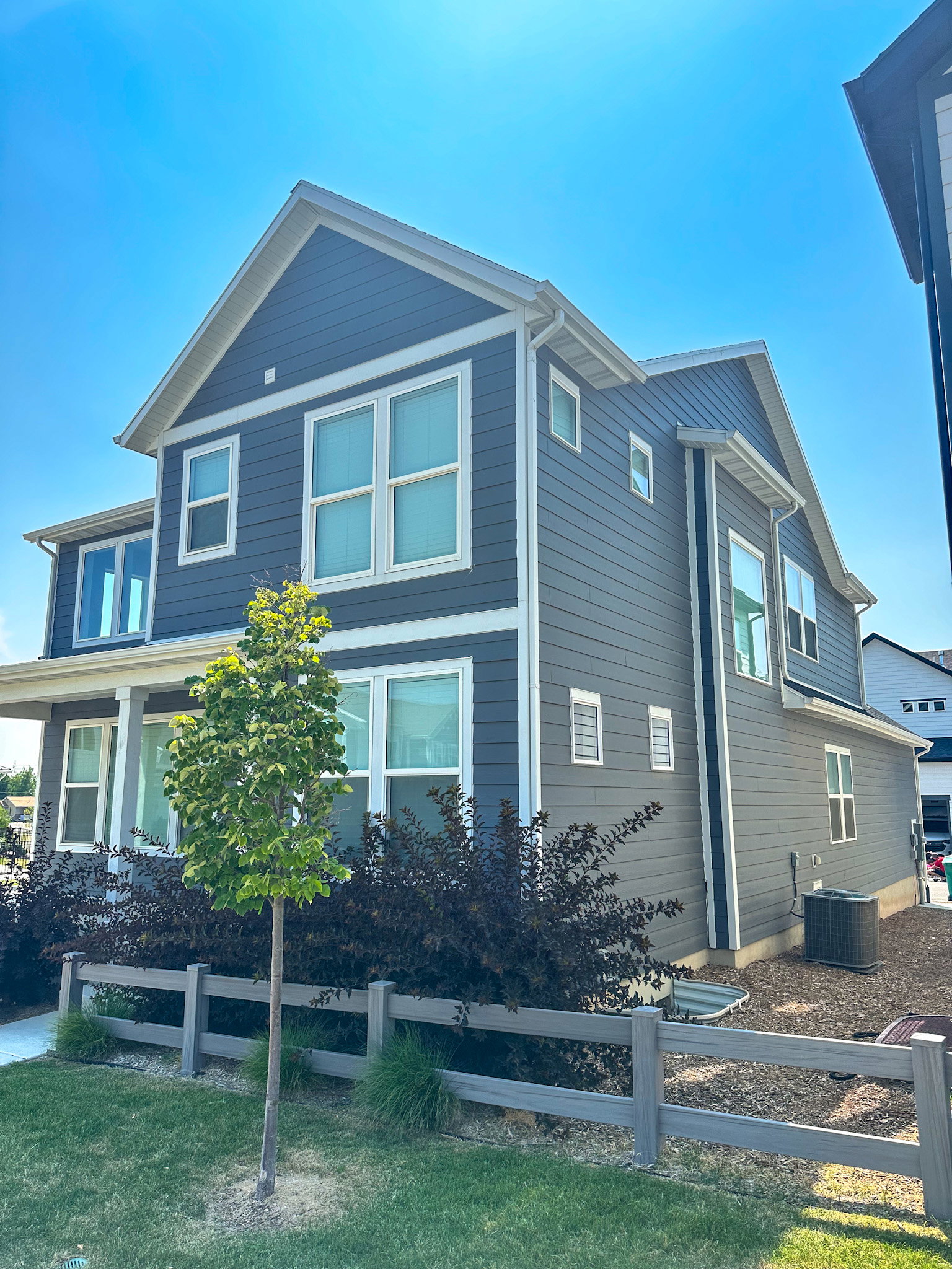 View of side of property featuring a fenced front yard