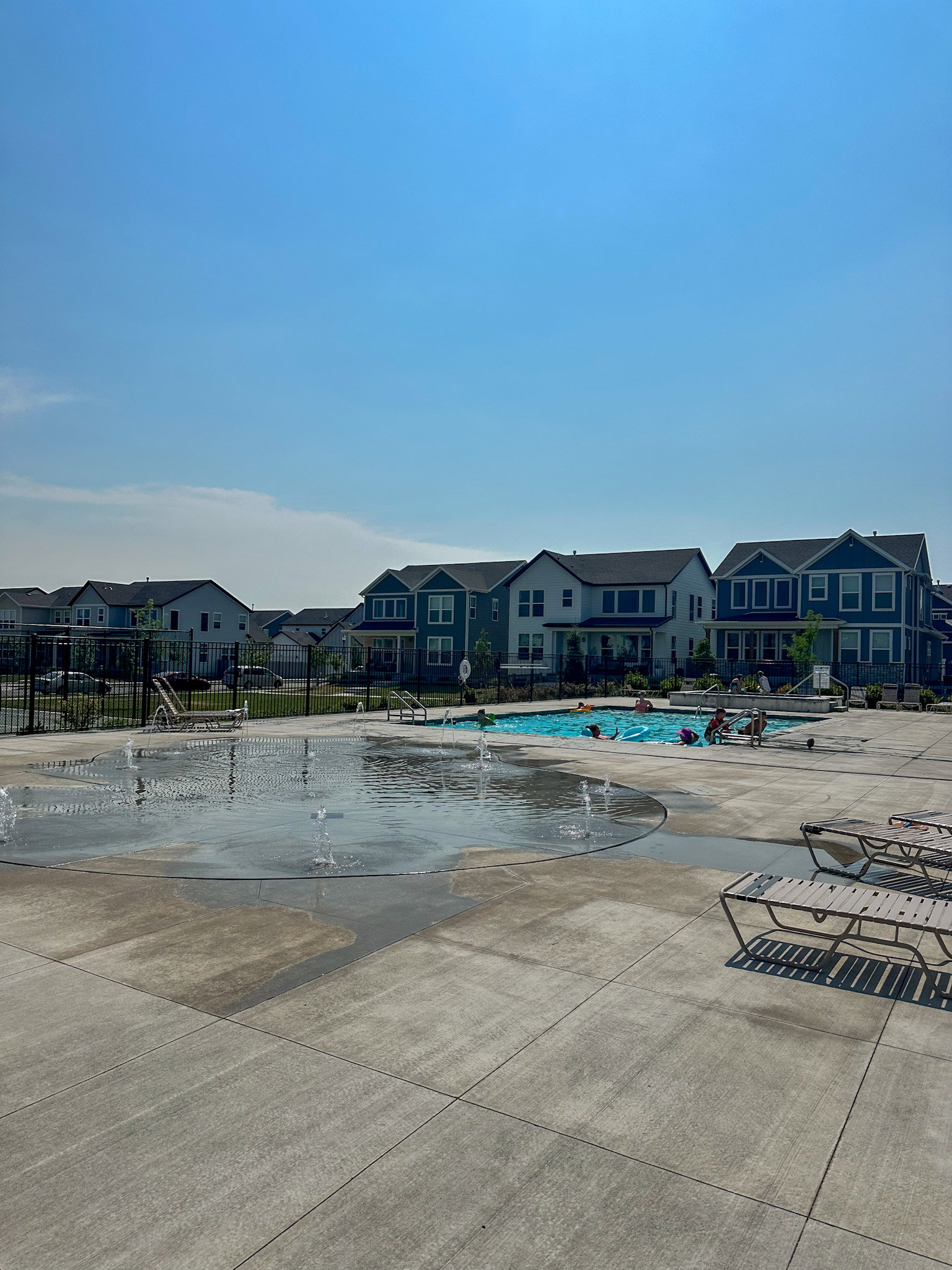 Community pool featuring a residential view