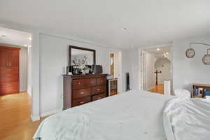 Bedroom with light wood-style floors and recessed lighting