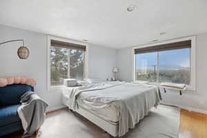 Bedroom with baseboards and light wood-style flooring