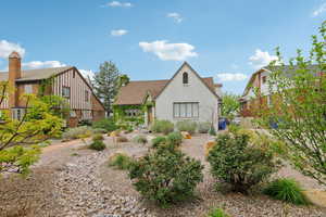 Back of house featuring stucco siding