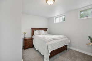 Carpeted bedroom with baseboards