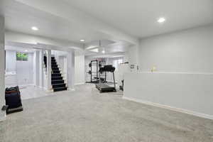 Exercise room featuring light colored carpet and recessed lighting