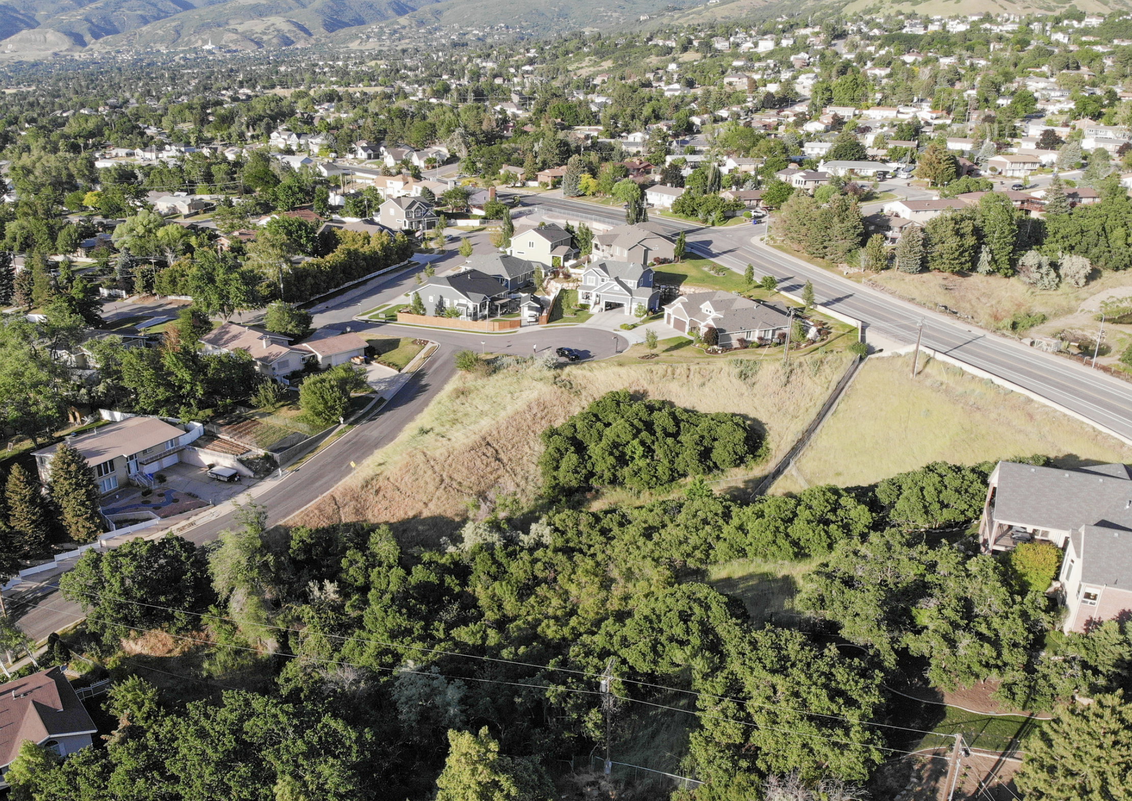 Aerial perspective of suburban area with mountains