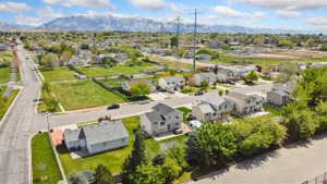 Aerial view of residential area featuring a mountain backdrop