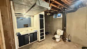 Unfinished basement with a sink