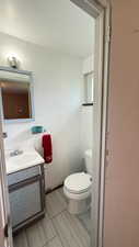 Bathroom featuring vanity and toilet