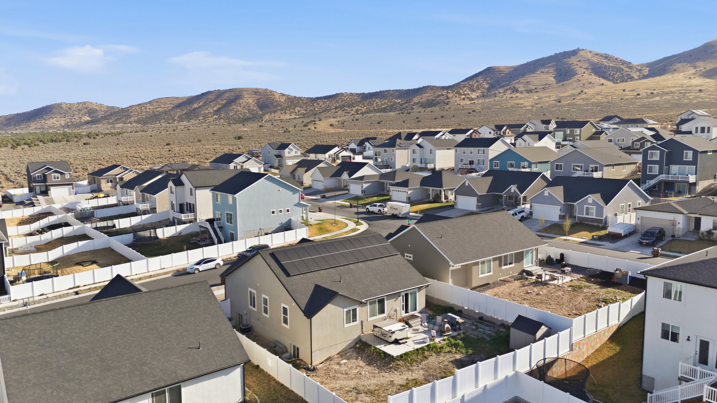 View of mountain backdrop featuring nearby suburban area