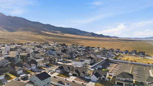 Aerial view of residential area featuring mountains