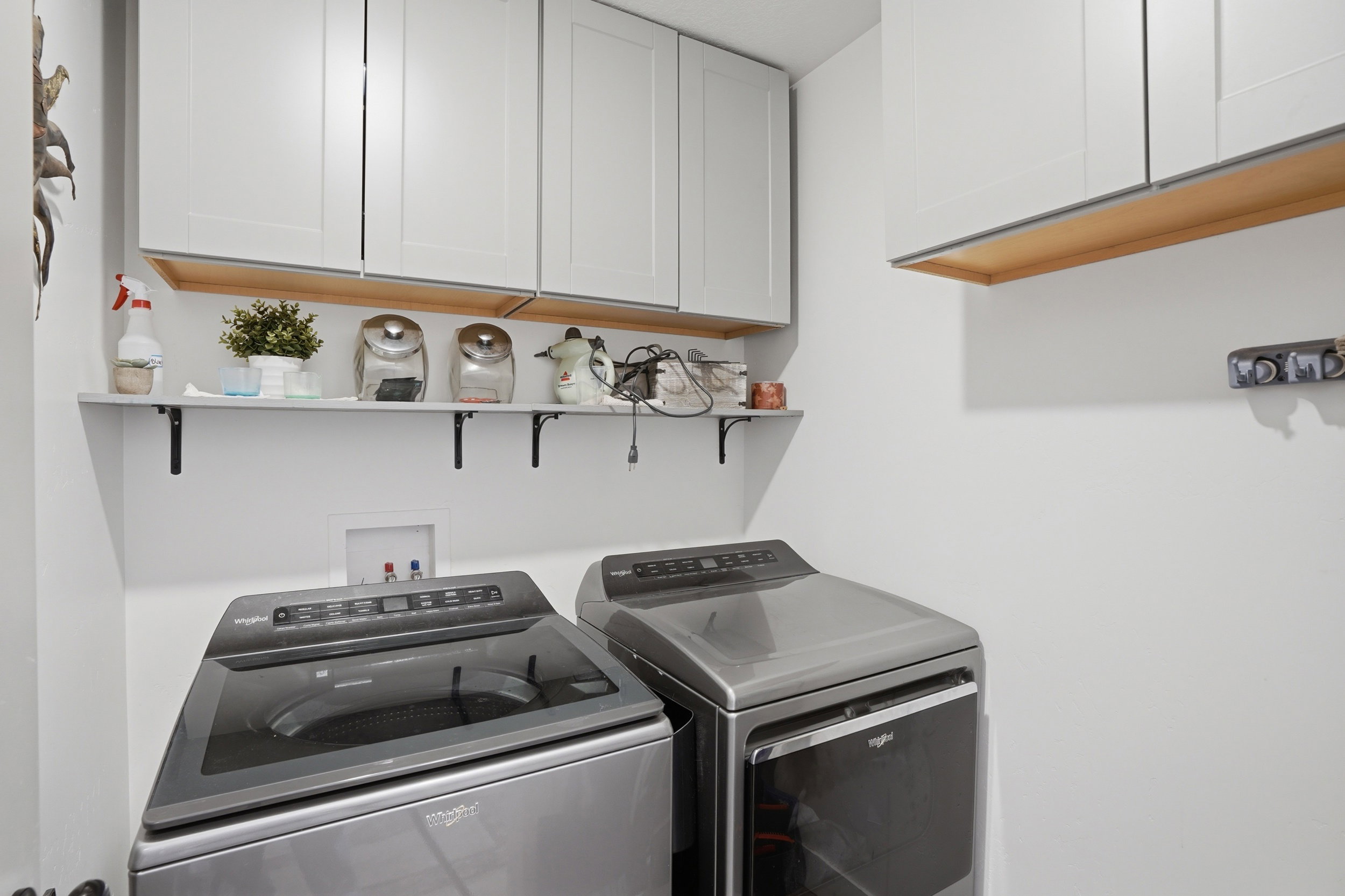Laundry area featuring cabinet space and washer and dryer