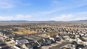 Aerial perspective of suburban area with a mountainous background