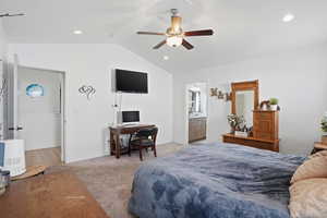 Bedroom with recessed lighting, light carpet, ceiling fan, ensuite bathroom, and an office area