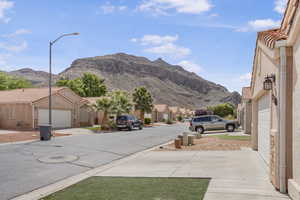 Mountain view featuring nearby suburban area