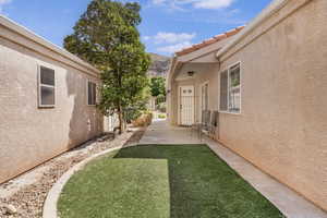 View of yard with a gate and a mountain view