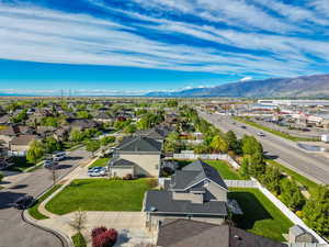 Aerial perspective of suburban area featuring a mountainous background