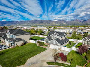 Aerial perspective of suburban area featuring a mountainous background