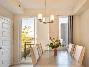 Dining area featuring baseboards and hanging lights