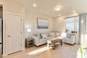 Living room featuring light wood-style floors and recessed lighting