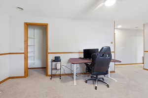 Office space with light carpet, recessed lighting, and a ceiling fan